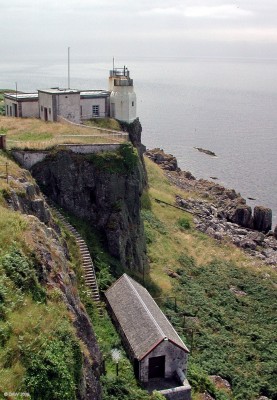 Cumbrae automatic Lighthouse
Possibly the least impressive lighthouse I've ever come across.  It looks like it has been installed in the compressor house of the old lighthouse.  If look very close you'll see the 'light' on the roof of the building nearest the cliff.  [url=http://www.streetmap.co.uk/streetmap.dll?G2M?X=213720&Y=651560&A=Y&Z=3/]Map location.[/url]

