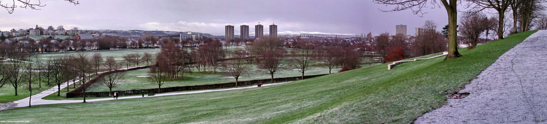 Bellahouston Park, Glasgow
Looking south west from Bellahouston park on a cold December day.  In 1982 this park was chosen as a venue for the visit of Pope John Paul II.  The Pope addressed a crowd of 300,000 from a stage erected close to the small wall on the right of this photo.  The Gleniffer Braes are in the background and on the right are the snow cover Renfrewshire Heights.
