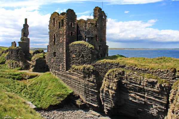 Ruins of Castle Sinclair, Noss Head, Caithness
The main building seen here is the tower house which dates from the late 16th to 17th century.  Its construction probably used some fabric from previous buildings.  It is made from dark grey Caithness stone with imported red sandstone for the quoins and dressings.  A [url=http://www.castlesinclairgirnigoe.org/index.html/] Trust [/url] has been set up to conserve and study the castle.
