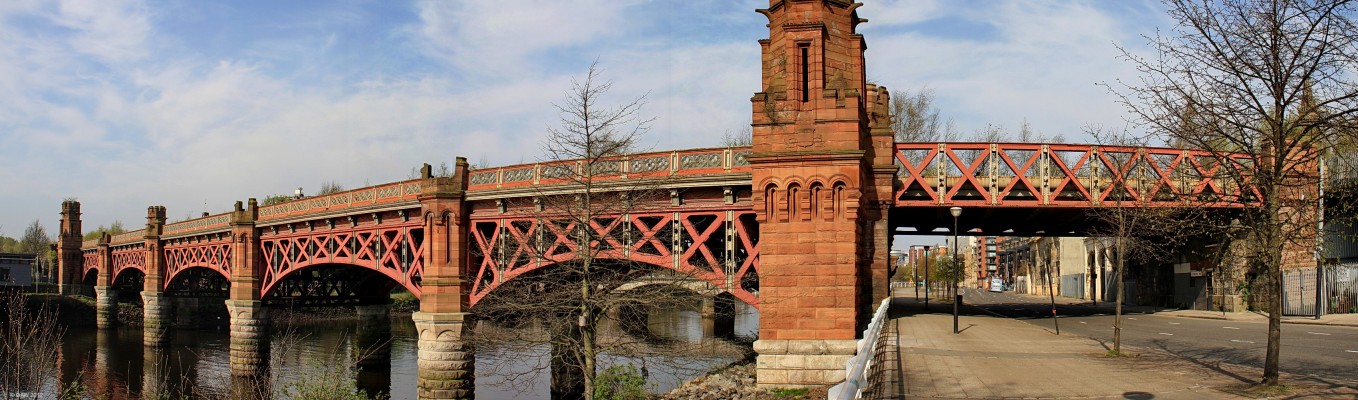 The City Union Railway Bridge, Glasgow
Opened in 1899, this was the first bridge across the Clyde to have a steel superstructure.  It was built to increase the capacity into St Enough Railway Station.  That station has long since gone but despite the apparent trees growing on the bridge it is still part of the rail network and in use today. [url=http://www.streetmap.co.uk/map.srf?X=259382&Y=664515&A=Y&Z=115/] Map location. [/url]
