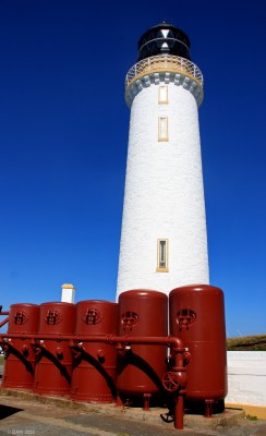 Mull of Galloway Lighthouse
The red tanks store compressed air for use with the fog horn that sits lower down on the cliff edge pointing out to see.  The fog horn is no longer in use.

