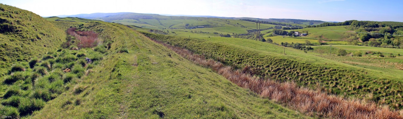 Dinvin Motte, South Ayrshire
Located just off the road from Girvan to Pinmore this the best preserved ring ditch hill fort in the south of Scotland.  It consists of a Motte and and two large ring ditches.  In this photo the Motte is on the left with the two circular ditches on the right.  It is thought to be around 2,500 years old and would have had wooden stockades on the top of each earth mound.  Even today parts of these ditches are still very deep with steep walls.
