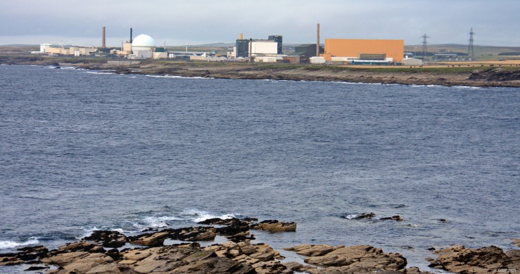Dounreay Nuclear site from near Fresgo Harbour
All parts of Dounreay are now in the decomissiong phase although there might be future work for the Vulcan test site, the large orange building.  This where reactor cores for Royal Navy sumbmarines were test and it may be used in the future for testing the small commerical reactors proposed by Rolls Royce.  [url=http://streetmap.co.uk/map?X=295380&Y=966432&A=Y&Z=120/] Map location. [/url]
