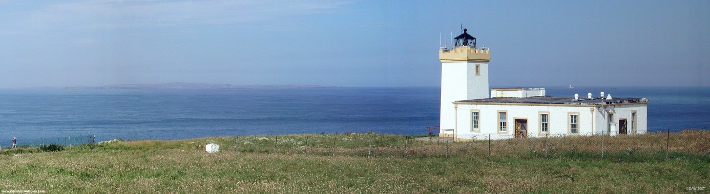 Duncansby Head Lighthouse
Duncansby Head lies on the most north easterly top of mainland Scotland.  The light house on the Pentland Skerries can be seen just above the lighthouse building.  On the right on the horizon you can just make out South Ronaldsay of the Orkney Islands.  [url=www.multimap.com/map/browse.cgi?lat=58.6435&lon=-3.0275&scale=25000&icon=x/]Map location[/url]
