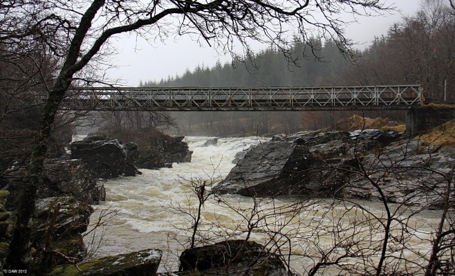 The bridge below the Eas Urchaidh falls, Glen Orchy
So much water its difficult to see the falls in this photo taken on a very wet February day. [url=http://www.streetmap.co.uk/map.srf?X=224231&Y=732062&A=Y&Z=115/] Map location. [/url]
