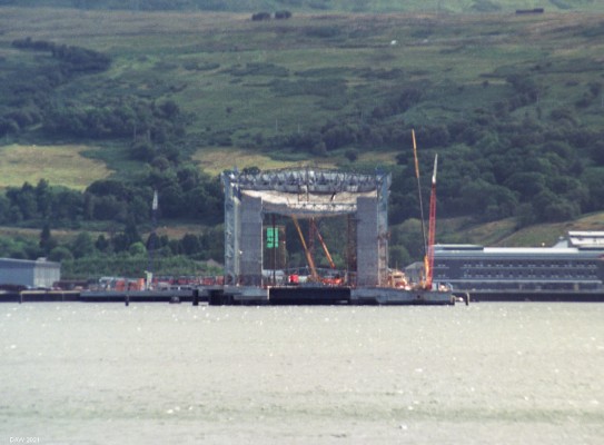 Faslane Shiplift under construction, 1990
A rather fuzzy long lens photograph of the Trident Ship lift under construction at Faslane in 1990.  The Trident project was and remains a controversial subject in Scotland.  As of 2021 four replacement Trident submarines are under construction and will enter service here later this decade.  [url=http://streetmap.co.uk/map.srf?X=223270&Y=689388&A=Y&Z=120/] Map location. [/url]
