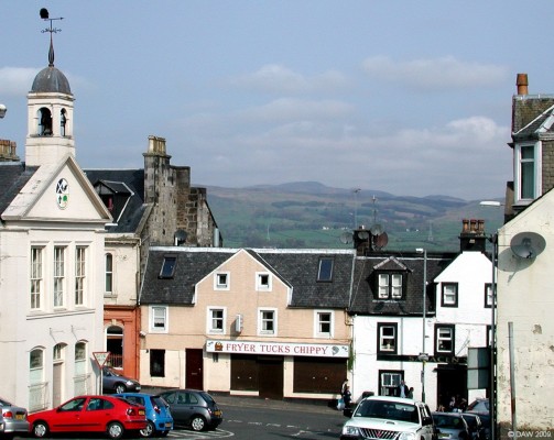 Fryer Tucks, Beith
On the left is the Town House, built in 1817.  This view shows how high Beith sits over the Garnock Valley.  In the distance are the hills of Clyde Muirshiel Park.  [url=http://www.streetmap.co.uk/map.srf?X=234832&Y=653877&A=Y&Z=110/] Map location. [/url]
