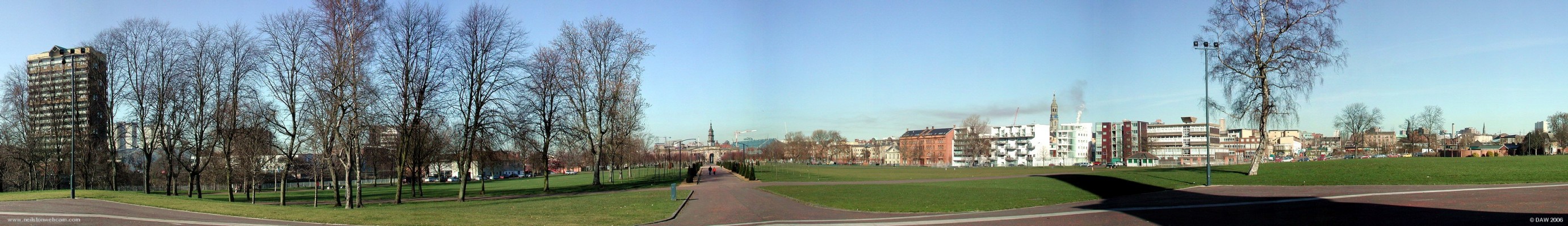Winter panoramic view over Glasgow Green
Glasgow green is Glasgow's oldest park, its history can be traced back to 1450 when James II granted the Green to Bishop William Turnbull for use as common grazing ground. The present layout dates from the early 19th century. This view is looking west, the tower block on the left is on the south side of the Clyde which runs behind the trees. The shadow on the right is from the 44 metre high Nelson's Monument.
