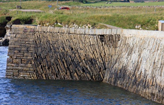 Fresgoe Harbour, Caithness
The old stone wall of Fresgoe harbour, built around 1830 by Major William Innes of Sandside. [url=http://www.streetmap.co.uk/map.srf?X=295855&Y=966083&A=Y&Z=115/] Map location. [/url]
