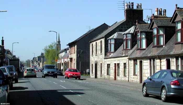 High Street, Stewarton
A view along Stewarton high street on a bright spring day.  [url=http://www.streetmap.co.uk/map.srf?X=242164&Y=646034&A=Y&Z=110/] Map location. [/url]

