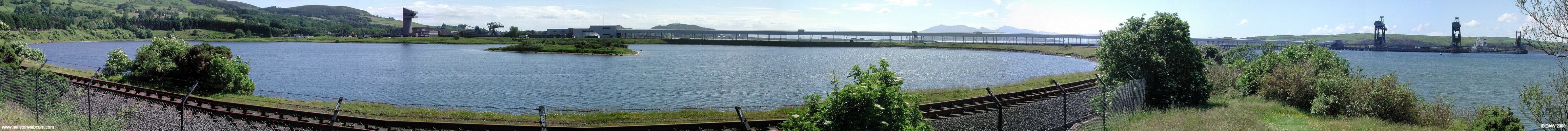 Hunterston Ore Terminal Panorama
Over looking the artificial lake created by the railway embankment.   Hunterston Ore Terminal was conveived in the late 60's when there were great plans for an integrated steal industry in Scotland. Today it mainly deals with imported coal, some leaves by rail and some is taken back out by smaller ships over to N. Ireland. [url=http://www.streetmap.co.uk/streetmap.dll?G2M?X=220380&Y=654310&A=Y&Z=3]Map location[/url]
