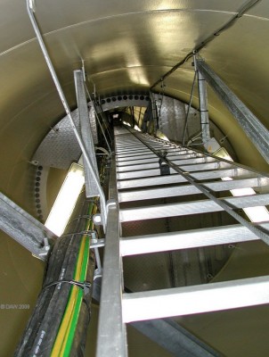 Inside a wind turbine mast
Ever wondered what the inside of a wind turbine looks like?  I thought not, but here it is anyway.  Not much more than a ladder 60m long all the way to the top.  Taken during an 'open day' at the Haupland Muir windfarm between West Kilbride and Ardrossan.
