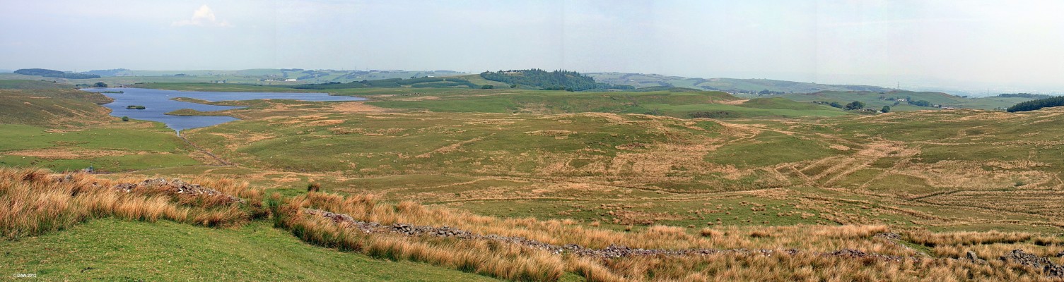 Panoramic view from James's Hill, East Renfrewshire
Looking North West from James's Hill, Harelaw Dam is on the left, the Neilston Pad is in the centre with the trees.  To the right you can just see the houses of Neilston and on the extreme right is Glasgow.  The ruined stone walls in the foreground are quite extensive and may have been used as sheep enclosures at some time.  [url=http://www.streetmap.co.uk/map.srf?X=248695&Y=653210&A=Y&Z=115/] Map location. [/url]

