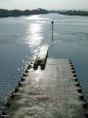 Slip way, John Brown's Shipyard, Clydebank
A seemingly uninteresting structure jutting out into the Clyde at the new Clydebank College.  But this is all that is left of the slip way at the former John Brown Ship yeard, some of Royal Navy's and Cunard's greatest ships were launched here across the Clyde into the mouth of the river Cart.  [url=http://www.streetmap.co.uk/map.srf?X=249755&Y=669380&A=Y&Z=115/] Map location. [/url]
