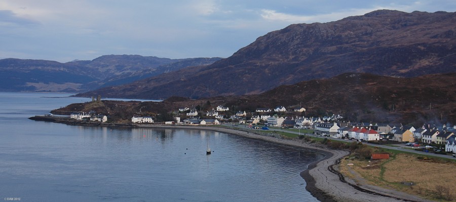 Kyleakin, Isle of Skye
Until not too long ago this is the place most people arrived on Skye via the ferry.  However, today it is by-passed by the new Bridge where this photo was taken from.  Most of what you see dates from the planned village of 1811 but on the left hand side you can see the remains of Caisteal Maol which dates from around the 14th century.  [url=http://www.streetmap.co.uk/map.srf?X=174505&Y=826790&A=Y&Z=120/] Map location. [/url]

