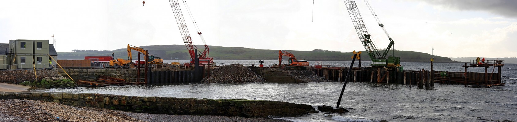 The demise of the old Largs Pier
The old stone pier at Largs half way through being demolished in spring 2009.  Its replacement allows more space for the over night berthing of the larger Cumbrae Car ferry.  The original pier dates from around the 1830's.
