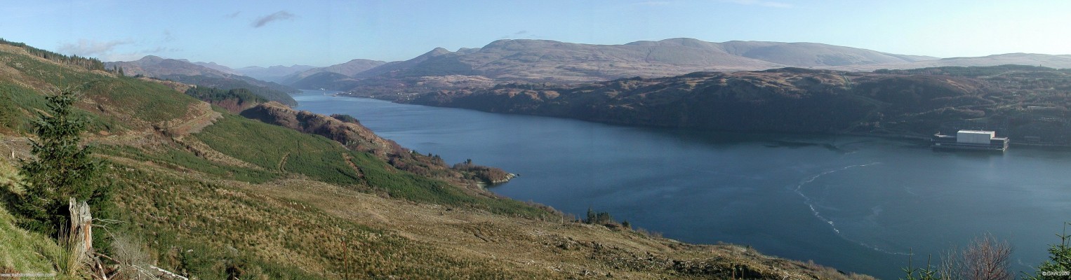 Loch Long panorama
This photo gives you an idea why Loch Long got its name.  In the distance you can just make out the pier at Finnart Oil terminal, above that is the Armaments jetty at Glenmallan, the loch continues for about another 5km beyond that until Arochar at the head of the Loch.  The floating dock on the right is part of RNAD Coulport.  [url=http://www.streetmap.co.uk/map.srf?X=219625&Y=689990&A=Y&Z=120/] Map location. [/url]
