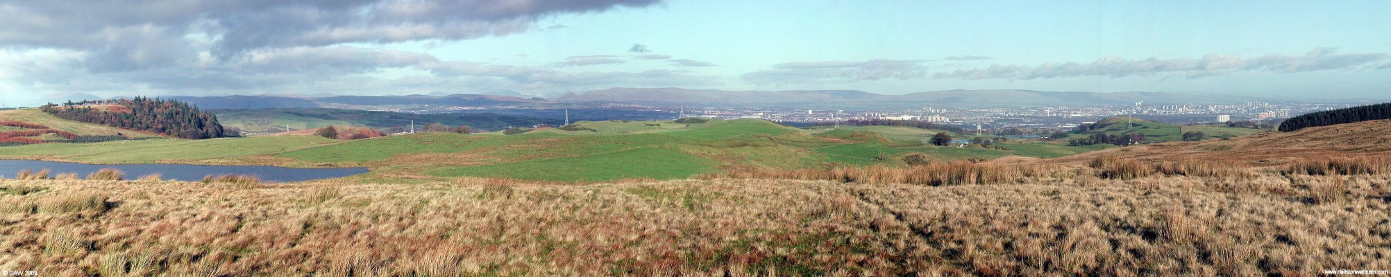 Panoramic view from Lochend Hill
At 262 metres Lochend Hill gives commanding views over Glasgow.  On the left is the Neilston Pad, you can just make out some of the top end of Neilston immediately to its right.  Harelaw Dam is also on the left, towards the right hand side Duncarnock Hill can be seen (the Craigie).  [url=http://www.streetmap.co.uk/map.srf?X=247970&Y=653235&A=Y&Z=115/] Map location. [/url]
