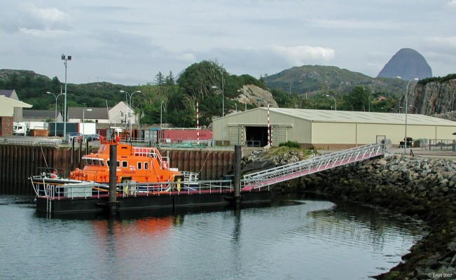 Lochinver lifeboat, Lochinver
There has been an RNLI lifeboat stationed at Lochinver since 1966, the current Severn class boat arrived in 2003.  The distinctive shape of Suilven rises to some 731m in the distance on the right hand side.  [url=http://www.multimap.com/map/browse.cgi?lat=58.1474&lon=-5.2479&scale=25000&icon=x/]Map location[/url]

