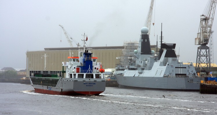 M.V. Scot Venture, Yoker
M.V. Scot Venture slips past HMS Dauntless undergoing final fitting out at BAE systems Yoker yard on a rather dreich summer day in 2009.
