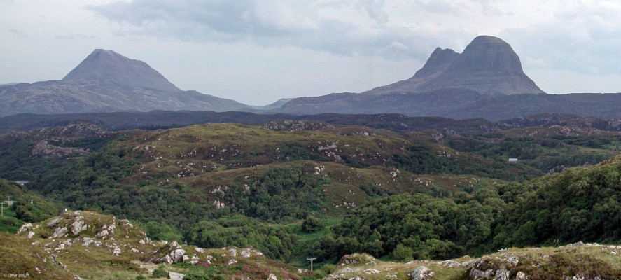 Looking towards the mountains of Canisp and Suilven
The mountains on the skyline are remnants of reddish-brown Torridonian sandstone, capped by younger & harder white quartzite.  Prolonged erosion of the sandstone has exposed a "fossil" landscape in the underlying grey Lewisian Gneiss of the foreground.  These are the oldest rocks in Britain, dated in parts at around 3,000 million years. [url=http://www.multimap.com/map/browse.cgi?lat=58.177&lon=-5.2751&scale=25000&icon=x/]Map location[/url]
