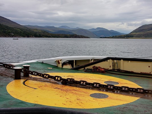 Mr Happy, Ullapool
Looking down Loch Broom from the pier at Ullapool.  Mr Happy is painted on the deck of the Coast Guard tug Anglian Prince.  [url=http://www.streetmap.co.uk/map.srf?X=212958&Y=893857&A=Y&Z=115/] Map location. [/url]

