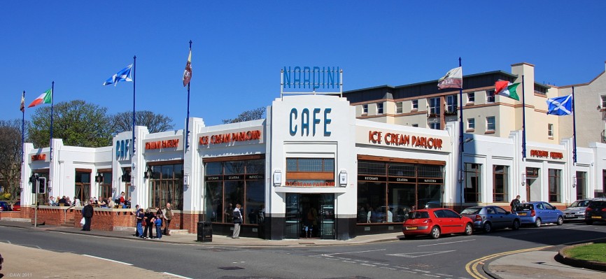 Nardini Cafe, Largs, 2009
The famous [url=http://www.nardinis.co.uk/] Nardini's [/url] Art Deco style Italian Cafe not long after it re-opened after a major refurbishment taking it back to more what it was like in 1935 when it first opened.  The main entrance has returned to the corner location.  The sale of land for the new flats behind were partly what financed the refurbishment.
