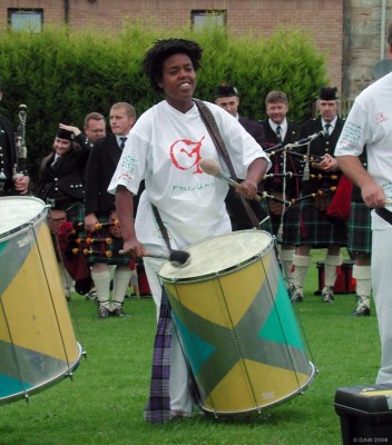 Macumba Drummer at Neilston Live! 2006
[url=http://www.macumba.com/]Macumba[/url] are a group of eight musicians based in Scotland who mix the traditional sounds of Scottish bagpipes with the sounds and rhythms of Brazilian and Caribbean percussion.
