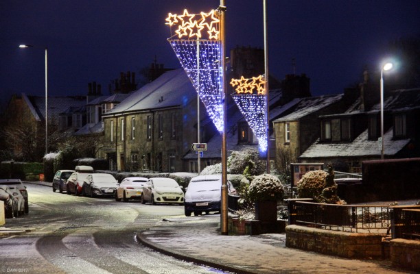 Neilston Main Street, Christmas 2017
A view along the Main Street after a light snow fall on Boxing day 2017.   This is the first year I can remember that Neilston had proper Christmas lights on the main street.
