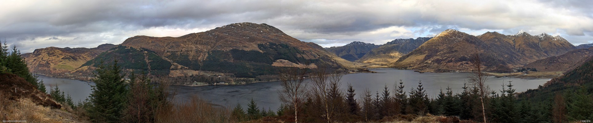 Panoramic view from Bealach Ratagain
The water of Loch Duich stretches across the picture, on the right are the Five Sisters, the highest being Sgurr Fhuaran at 1067m.  On the left is Sgurr an Airgid rising to some 841m. [url=http://www.streetmap.co.uk/map.srf?X=190432&Y=819855&A=Y&Z=120/] Map location. [/url]
