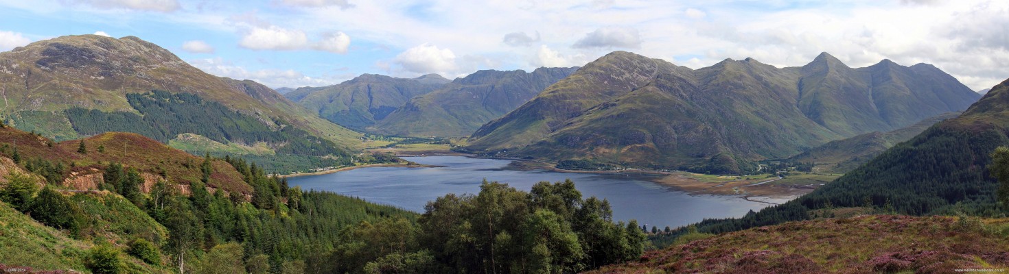 Overlooking Loch Duich from the Pass of Ratagain
A summer view over Loch Duich, the Five Sisters are on the right.  Notice the old fish trap at the right hand side down at the shore.  This was used to catch fish as the tide receded. [url=http://streetmap.co.uk/map.srf?X=190424&Y=819860&A=Y&Z=120/] Map location. [/url]
