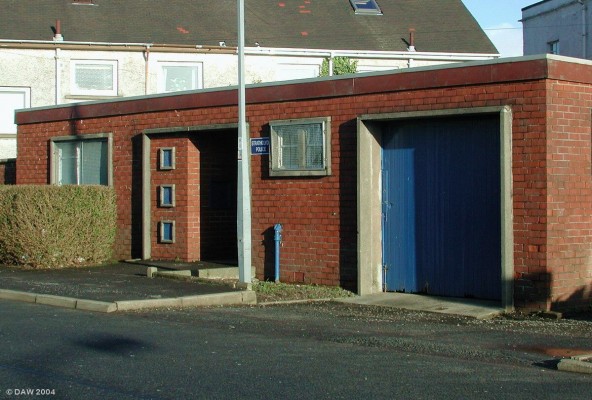 Neilston Police Station
You could easily mistake this unimaginative 1960's building to be someone's lockup but infact its what passes as a police office.  There's not much point knocking on the door shouting 'Mudrer, Polis', though, its no longer manned.
