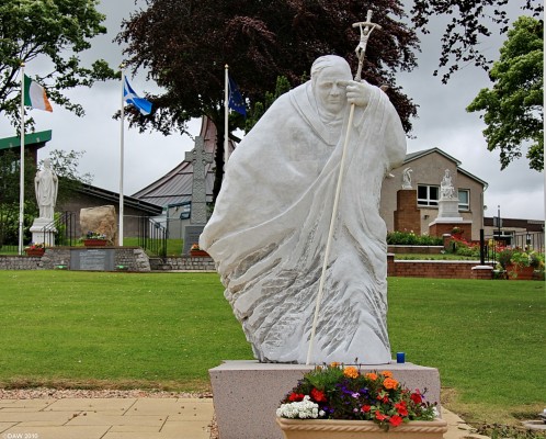 Pope John Paul statue, Carfin Grotto
A statue of Pope John Paul at the [url=http://www.carfin.org.uk/index.htm/] Carfin Grotto [/url].  Pope John Paul visited Glasgow in 1982, in the background is the Irish Site which celebrates the Irish decendency of most Scottish Catholics.  [url=http://www.streetmap.co.uk/map.srf?X=277478&Y=658594&A=Y&Z=115/] Map location. [/url]
