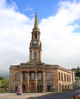 The former Municipal Building, Port Glasgow
Built in 1815 to the design of David Hamilton at a cost of �12,000.  If you look close you'll see the 150ft steeple is topped with a fully rigged copper ship.  In 1996 the building was refurbished and extended and is in use as a Library and office space. [url=http://www.streetmap.co.uk/map.srf?X=232213&Y=674560&A=Y&Z=115/] Map location. [/url]
