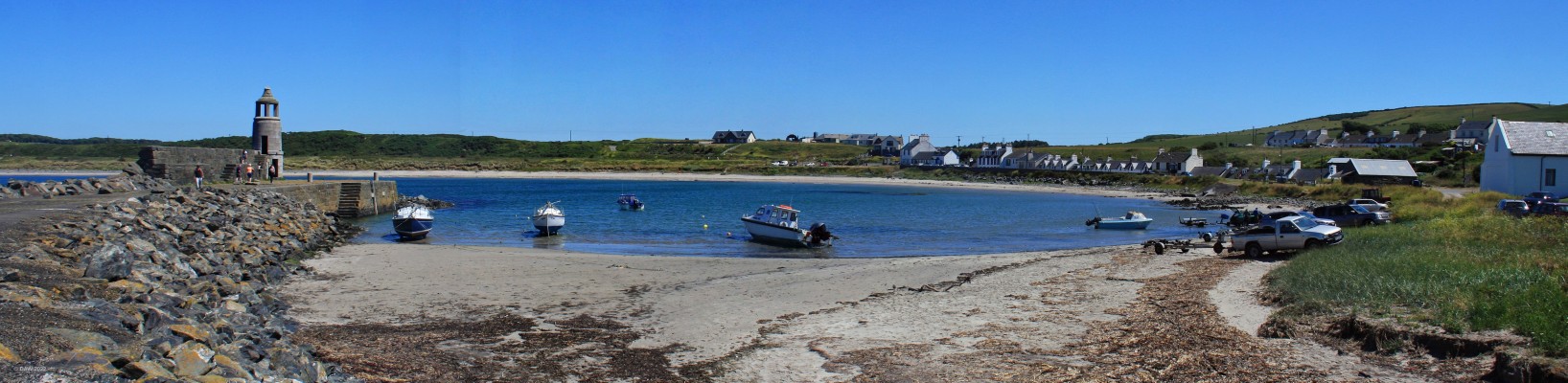 Port Logan, Mull of Galloway
Port Logan is a small village half way down the Mull of Galloway.  It is a planned village, created by Colonel Andrew MacDowall, the Laird of Logan in 1818.  The stone pier with its bell tower was designed by Thomas Telford.  [url=http://streetmap.co.uk/map?X=209508&Y=540465&A=Y&Z=120/] Map location. [/url]
