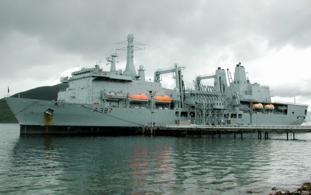 RFA Fort Victoria moored alongside the NATO fuel depot on Loch Striven
The Fleet Replenishment Ship, Fort Victoria, entered service in 1994.  She displaces some 31,565 tons and has a length of 204 metres.  She can carry up to 6,250m? of solids stores plus 12,500m? of liquids.  She is better armed than her predecessors, a Phalanx CIWS can be seen above the bridge and also above the helicopter hanger at the stern.

