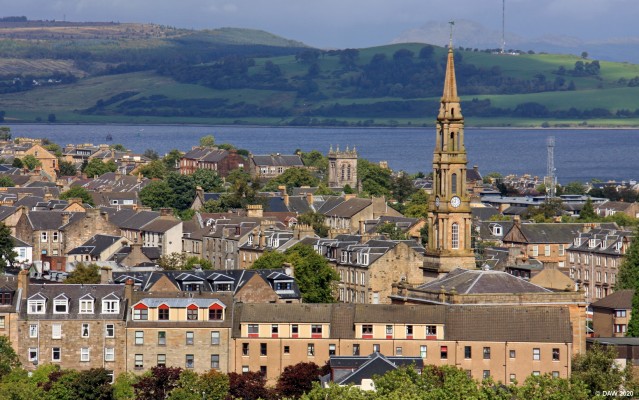 Rear Windows, Greenock
Looking north West across Greenock from the 10th floor of a block of flats.  The Spire is that of the Westburn Church.  The Church dates from 1841 but the spectacular Steeple was added until 1854.
