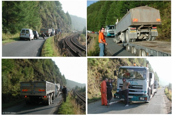 Road block,  Loch Carron
This is what happens on a single track road when a lorry breaks down.  To make matters worse the rescue attempt failed when the steel tow bar broke and smashed the cab after an attempt to push the lorry up onto the low loader, no one was hurt but it would make an interesting insurance claim.  Hard to believe but this is the A890 trunk road and the alternative would be a 100 mile detour.  www.leiths-group.co.uk
