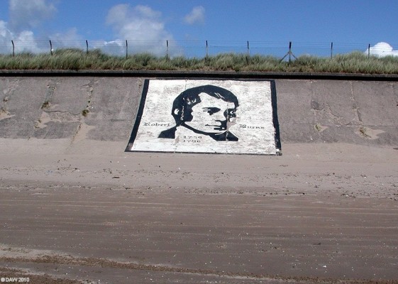 Robert Burns, Ardeer Beach
This rather strange piece of 'Graffiti' can be found on the sea wall at Ardeer Beach.  I've no idea when it was painted but presumably the idea was that it be seen  from aircraft on final approach to Prestiwck Airport in the days when it was Scotland's only International Airport.  [url=http://www.streetmap.co.uk/map.srf?X=227949&Y=639868&A=Y&Z=115/] Map location. [/url]
