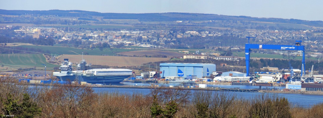 Rosyth Shipyard, 2015
A view of Rosyth shipyard in 2015 when HMS Queen Elizabeth was fitting out.  To the right of her you can see that construction of the Prince of Wales is well under way.  [url=http://streetmap.co.uk/map.srf?X=309495&Y=677940&A=Y&Z=120/] Map location. [/url]
