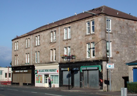 Tenement block, Neilston Main Street
At one time the entire ground floor shop of this building was taken up by the Neilston branch of the Barrhead Co-operative Society.  The society was formed in 1861 by 14 Barrhead men.   [url=http://www.streetmap.co.uk/streetmap.dll?G2M?X=247915&Y=657223&A=Y&Z=1/]Map location.[/url]
