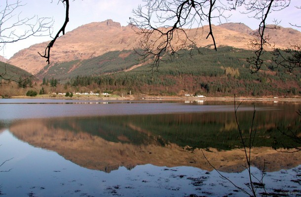 A view of The Cobbler from the east shore of Loch Long
Ben Arthur, or The Cobbler, as it is more commonly know is the peak to the left of centre, rising to 881 metres.  On a calm early spring day like this the shore road from Finnart to Arrochar always provides spectacular reflections of the Arrochar Alps as  they are affectionately called.
