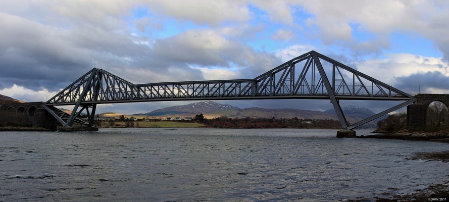 The Connel Bridge
When opened in 1903 this Railway Bridge had a wider span (152m)than any other bridge in the UK except the Forth Rail Bridge.  It was built for the Callander and Oban Railway.  In 1913 the bridge was also used for cars when there no trains running.  WHen the line closed in 1966 the bridge was solely used for vehicular transport although it is only wide enough for one way at a time with traffic lights at either end. [url=http://www.streetmap.co.uk/map.srf?X=190915&Y=734330&A=Y&Z=120/] Map location. [/url]
