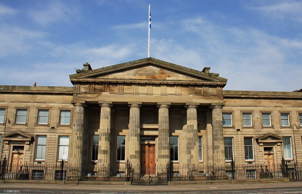 The High Court, Glasgow
One of Scotland's two Supreme courts, the other being in Edinburgh.  This building was completed in 1814 with its historically accurate Greek Doric portico.  Behind the portico, an atrium leads to two full height courtrooms.  A new extension with extra courts was built at the rear in 1997 and a new entrance provided so this grand entrance is no longer used. [url=http://www.streetmap.co.uk/map.srf?X=259495&Y=664527&A=Y&Z=115/] Map location. [/url]
