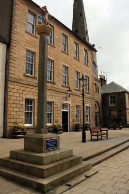 The Mercat Cross, Banff
The exact history of the Mercat cross in Banff is unclear but it is thought to date from around 1540.  In 1768 it was removed from its position on the present day site of the Biggar Fountain and placed on top of a Dovecot in a field.  In 1900 after an absence of 132 years it was returned to its present location in front of the Town House
