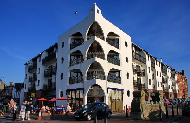 The Moorings, Largs
Today this site is a housing development but for 50 years it was home to a large Ballroom, a Cafe and also a Restaurant run by the Castelvecchi family.  Since the old building was such a landmark and in such a prominent position in Largs its replacement was designed to look similar with the corner appearing like the Bow of a Ship.

