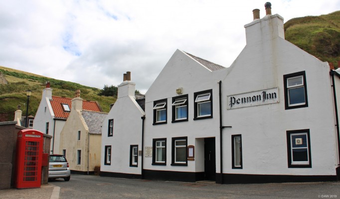 The Pennan Telephone Box
To many this is just a telephone box in an Aberdeenshire coastal village.  But to others this is the  telephone box in the classic 1983 Bill Forsyth film, "Local Hero".  All was not quite how it seemed in the film though, the supposedly local beach scenes were actually filmed at the white sands of Morar away over on the west coast.  [url=http://streetmap.co.uk/map.srf?X=384582&Y=865487&A=Y&Z=115/] Map location. [/url]
