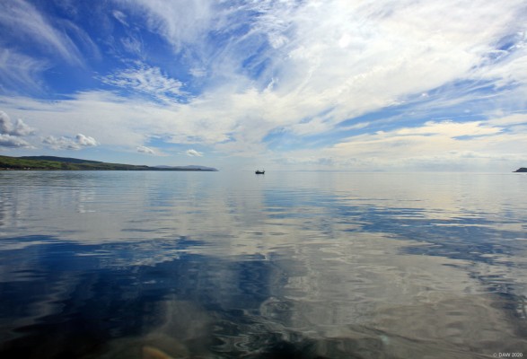 The Sound of Gigha
Looking south west from the middle of the Sound of Gigha on a fery calm crossing on the ferry.  Kintyre in on the left and you can just see the Island of Cara on the extreme right.  [url=http://streetmap.co.uk/map.srf?X=167906&Y=647358&A=Y&Z=120/] Map location. [/url]
