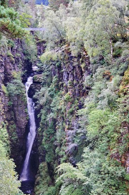 The falls of Measach
The Falls of Measach are about 12 miles east of Ullapool in the Corrieshalloch Gorge. The Gorge runs for about a mile and is one of the best examples of a box canyon in the UK, it is also a nature reserve run by the National Trust for Scotland. The falls drop about 150ft, if you look closely at this picture you'll see a suspension bridge above the falls that gives an idea of their scale. The Bridge was built by John Fowler who also played a part in the design of the Forth Railway Bridge. 
