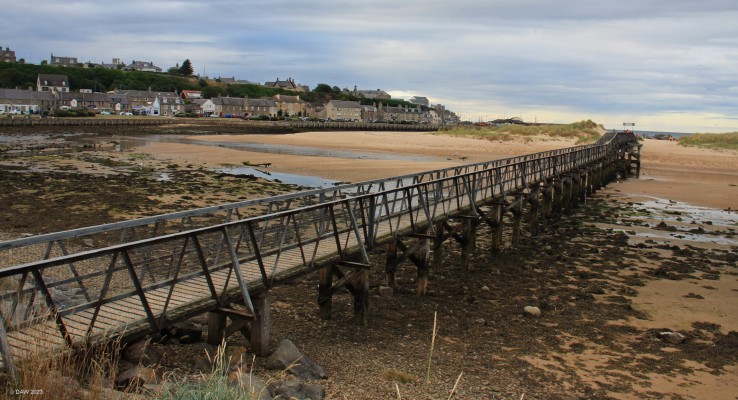 The old footbridge, Lossiemouth Beach, 2018
This footbridge stood for nearly 100 years as a way of getting across the river Lossie to the east beach.  This beach and its dunes are without doubt one of Lossiemouth's best assets.  In 2019 the bridge was deemed unsafe and was closed.   It took until May 2022 for a new replacement to be built and opened giving safe access again to the beach.
